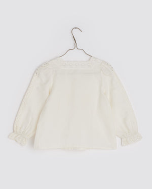Girls scalloped collared blouse with long sleeves, buttons down the front and pleats on the chest, in the colour off white, by Little Cotton Clothes. 