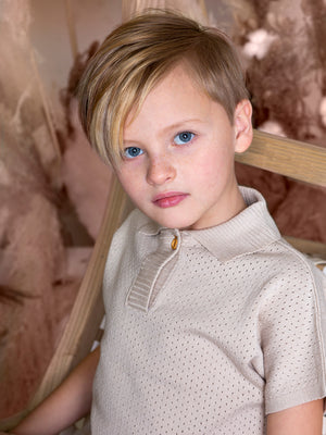 Belati kids boxy pointelle knit shirt with single button closure for boys and girls in beige.