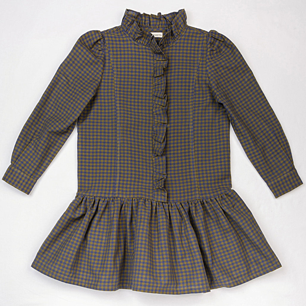 Purple check girls dress with gathered drop waist, ruffled trim down the chest and a high neck ruffled collar. By Ketiketa