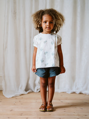 Girl Wearing Little Cotton Clothes Amellia Shorts in Blue Linen