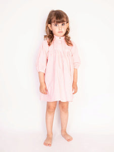 Girl Wearing Morley Piper Smart Dress In Pink.